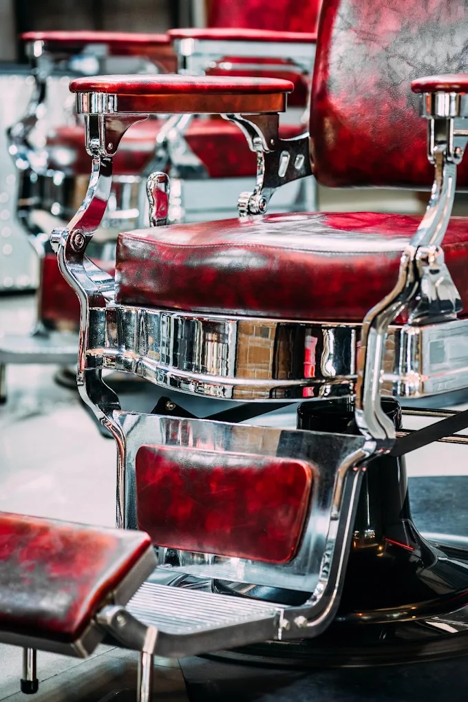 Red leather and polished chrome on a classic barber chair